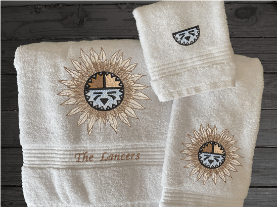 White bath towel set or individual towels, embroidered Southwest Sun Symbol is the perfect design for the western living family, that farmhouse decor. This Luxury western theme towel set 3 towels 1 bath towel 27" x 50", 1 hand towel 16" x 27", 1 wash cloth 13" x 13". You can personalize the towel set with a name and an initial on the wash cloth or just the designs. Borgmanns Creations