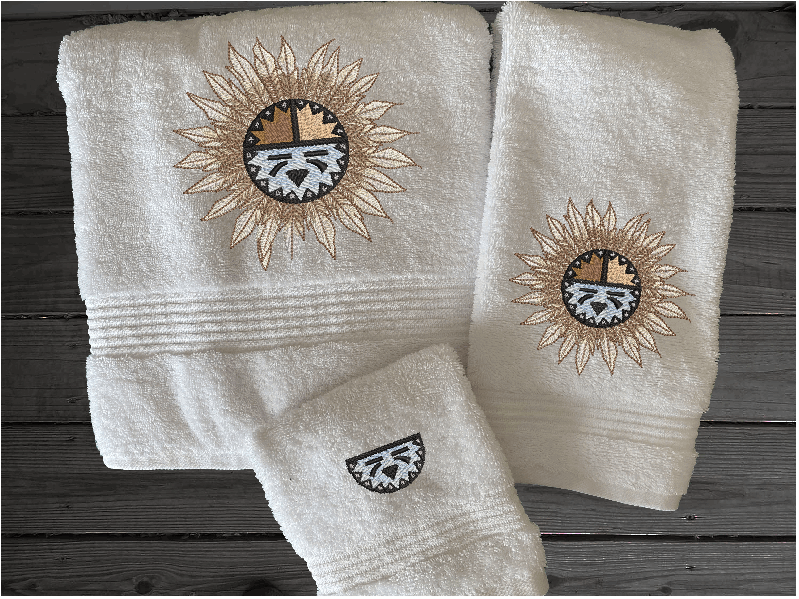 Bath towel set or individual towels, embroidered Southwest Sun Symbol is the perfect design for the western living family, that farmhouse decor. This Luxury western theme towel set 3 towels 1 bath towel 27" x 50", 1 hand towel 16" x 27", 1 wash cloth 13" x 13". You can personalize the towel set with a name and an initial on the wash cloth or just the designs. Borgmanns Creations
