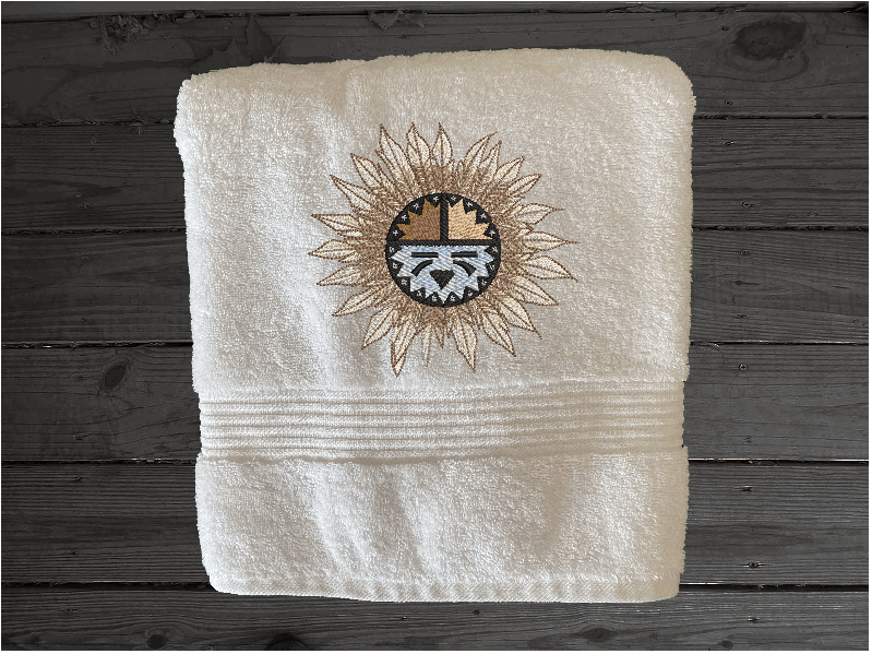 White bath towel, embroidered Southwest Sun Symbol is the perfect design for the western living family, that farmhouse decor. This Luxury western theme towel set 3 towels 1 bath towel 27" x 50", 1 hand towel 16" x 27", 1 wash cloth 13" x 13". You can personalize the towel set with a name and an initial on the wash cloth or just the designs. Borgmanns Creations
