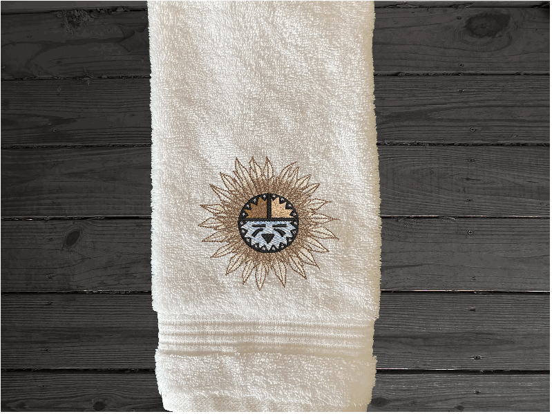 White hand towel, embroidered Southwest Sun Symbol is the perfect design for the western living family, that farmhouse decor. This Luxury western theme towel set 3 towels 1 bath towel 27" x 50", 1 hand towel 16" x 27", 1 wash cloth 13" x 13". You can personalize the towel set with a name and an initial on the wash cloth or just the designs. Borgmanns Creations