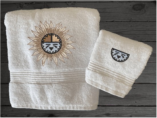 White bath towel and washcloth, embroidered Southwest Sun Symbol is the perfect design for the western living family, that farmhouse decor. This Luxury western theme towel set 3 towels 1 bath towel 27" x 50", 1 hand towel 16" x 27", 1 wash cloth 13" x 13". You can personalize the towel set with a name and an initial on the wash cloth or just the designs. Borgmanns Creations