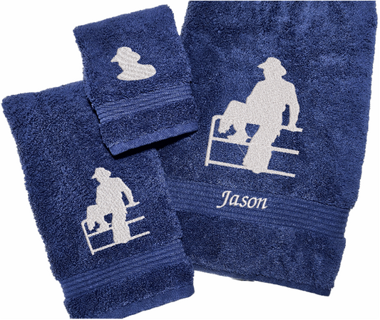 High Quality Luxury Blue Turkish Towels durable soft and absorbent, finished edges with a decorative band. Set has 1 bath towel 27" x 50", 1 hand towel 16"  x 27", 1 washcloth 13" x 13". Embroidered with a custom design of acowboy on a fence. You can personalize the bath towel with a name and an initial on the washcloth or just the designs. These luxury towels will make a wonderful hostess towel, wedding gift, housewarming gift, or for your own bathroom decor. Borgmanns Creations
