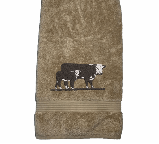 Beige bath towel , Hereford Cow design is just the item you can display with your ranch name embroidered on it, for that farmhouse decor. This Luxury western theme towel set of 3 towels 1 bath towel 27" x 50", 1 hand towel 16" x 27", 1 wash cloth 13" x 13". Personalize the bath towel with a name and initial on the washcloth  - Borgmanns Creations