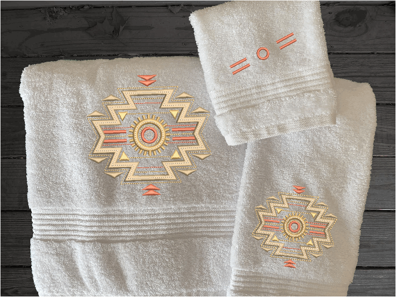 White bath towel set or individual towels, embroidered Southwest Symbol is the perfect design for the western living family, that farmhouse decor. This Luxury western theme towel set 3 towels 1 bath towel 27" x 55", 1 hand towel 16" x 27", 1 wash cloth 13" x 13". You can personalize the bath owel with a name. Borgmanns Creations