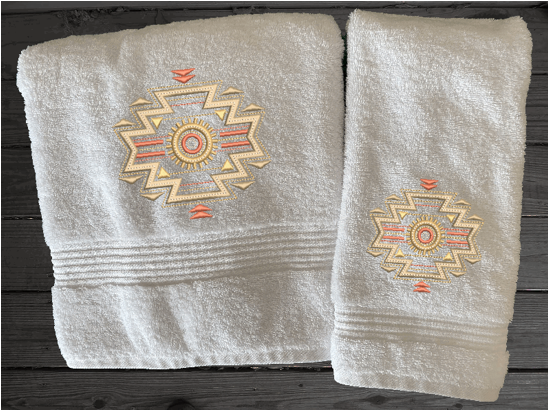 White bath and hand  towels embroidered Southwest Symbol is the perfect design for the western living family, that farmhouse decor. This Luxury western theme bath towel is 27" x 55", the washcloth is 16" x 27" Borgmanns Creations