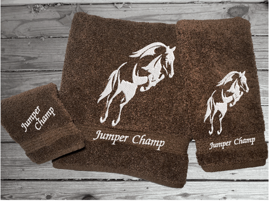 Brown luxury Bath towel set, personalize embroidered jumping horse is the perfect design for the horse living family, that English decor. This Luxury horse towel set has  3 towels 1 bath towel, 1 hand towel, 1 wash cloth. You can personalize the towel set with a name and an initial on the wash cloth or just the designs. Borgmanns Creations  1