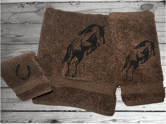 Brown luxury Bath towel set, embroidered jumping horse is the perfect design for the horse living family, that English decor. This Luxury horse towel set has  3 towels 1 bath towel, 1 hand towel, 1 wash cloth. You can personalize the towel set with a name and an initial on the wash cloth or just the designs. Borgmanns Creations 2