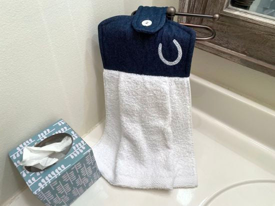 A soft and absorbing hanging bathroom/kitchen towel with button to hang on oven door or drawer handle. 16" x 9 1/2" terry towel with white denim top with batting overall leingth 17 inches. The embroidered horseshoe  showes off the western theme perfect gift for mom. Housewarming, bridal shower, anniversary, etc. Borgmanns Creations -4