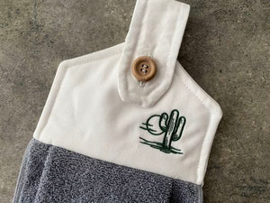 A soft and absorbing hanging bathroom/kitchen towel with button to hang on oven door or drawer handle. 16" x 9 1/2" terry towel with white denim top with batting overall leingth 17 inches perfect gift for mom, for her guests to use. Makes a wonderful housewarming gift, bridal shower, anniversary, Christmas, etc. Borgmanns Creations - 1