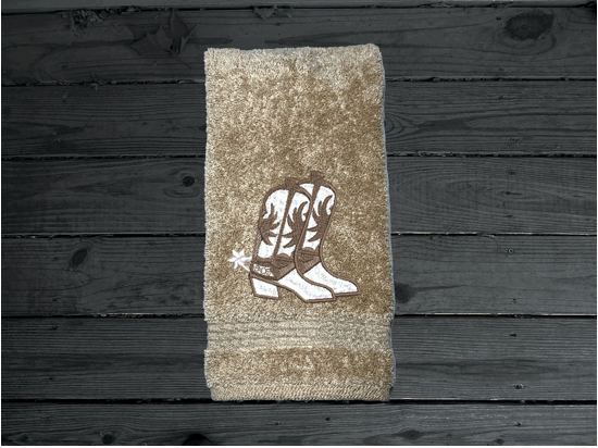 Beige western hand towel, cowboy hat and boots, this Luxury Turkish Towel set has 3 towels  1 bath towel 27" x 50", 1 hand towel 16" x 27", 1 washcloth - 13" x 13" the perfect design for the western farmhouse decor. You can personalize this bathroom towel set will make a wonderful wedding gift.  Borgmanns Creations 