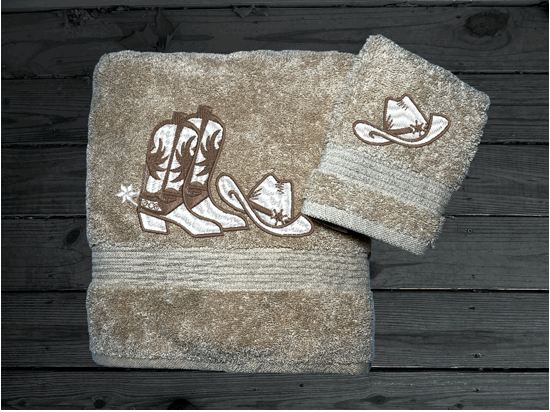 Beige western bath towel and washcloth, cowboy hat and boots, this Luxury Turkish Towel set has 3 towels  1 bath towel 27" x 50", 1 hand towel 16" x 27", 1 washcloth - 13" x 13" the perfect design for the western farmhouse decor. You can personalize this bathroom towel set will make a wonderful wedding gift.  Borgmanns Creations 