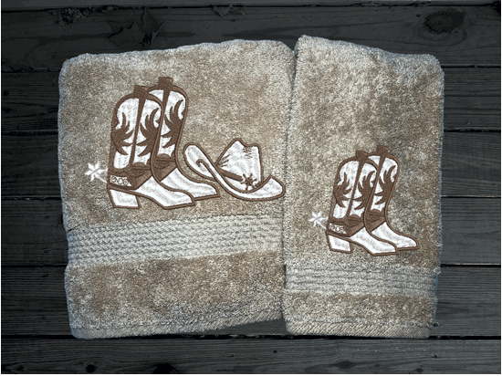 Beige western baath towel and hand towel, cowboy hat and boots, this Luxury Turkish Towel set has 3 towels  1 bath towel 27" x 50", 1 hand towel 16" x 27", 1 washcloth - 13" x 13" the perfect design for the western farmhouse decor. You can personalize this bathroom towel set will make a wonderful wedding gift.  Borgmanns Creations 