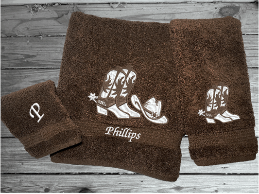 Brown bath towel set or individual towels, cowboy hat and boots is the perfect design for that farmhouse decor. This Luxury western theme towel set 3 towels 1 bath towel 27"x55", 1 hand towel 16"x28", 1 wash cloth 13" x 13". You can personalize the towel set with a name and an initial on the wash cloth or just the designs. Borgmanns Creations 1