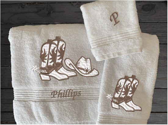 High Quality Luxury White Turkish Towels durable soft and absorbent, finished edges with a decorative band. Set has 1 bath towel 27" x 55", 1 hand towel 16" x 27", 1 washcloth 13" x 13". Embroidered with a custom design. You can personalize the towel set with a name and an initial on the washcloth or just the designs. These luxury towels will make a wonderful wedding gift, housewarming gift, or for your own bathroom decor. Borgmanns Creation
