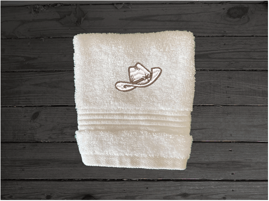 White washcloth high quality luxury Turkish towels durable soft and absorbent, finished edges with a decorative band. Set has 1 bath towel 27" x 55", 1 hand towel 16" x 27", 1 washcloth 13" x 13". Embroidered with a custom design. You can personalize the towel set with a name and an initial on the washcloth or just the designs. These luxury towels will make a wonderful wedding gift, housewarming gift, or for your own bathroom decor. Borgmanns Creation
