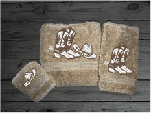 Load image into Gallery viewer, Beige western bath towel set or individual towels, cowboy hat and boots, this Luxury Turkish Towel set has 3 towels  1 bath towel 27&quot; x 55&quot;, 1 hand towel 15&quot; x 28&quot;, 1 washcloth - 13&quot; x 13&quot;the perfect design for the western farmhouse decor. You can personalize this bathroom towel set will make a wonderful wedding gift.  Borgmanns Creations -2
