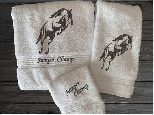 White bath towel set or individual towels, embroidered jumping horse is the perfect design for the horse living family, that English decor. This Luxury horse towel set of 3 towels 1 bath towel 27' x 50", 1 hand towel16" x 27", 1 wash cloth 13" x 13". You can personalize the towel set with a name and an initial on the wash cloth or just the designs - Borgmanns Creations 