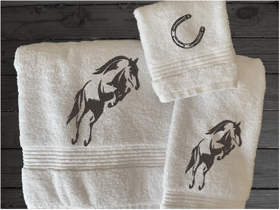 White bath towel set or individual towels, embroidered jumping horse is the perfect design for the horse living family, that English decor. This Luxury horse towel set of 3 towels 1 bath towel 27' x 50", 1 hand towel16" x 27", 1 wash cloth 13" x 13". You can personalize the towel set with a name and an initial on the wash cloth or just the designs - Borgmanns Creations