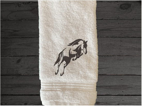 White hand tow, embroidered jumping horse is the perfect design for the horse living family, that English decor. This Luxury horse towel set of 3 towels 1 bath towel 27' x 50", 1 hand towel16" x 27", 1 wash cloth 13" x 13". You can personalize the towel set with a name and an initial on the wash cloth or just the designs - Borgmanns Creations