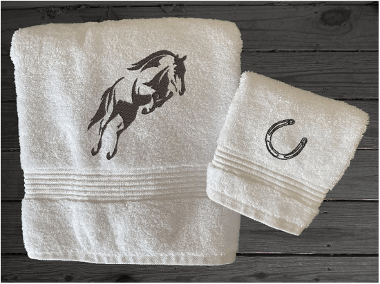 White bath towel and washcloth, embroidered jumping horse is the perfect design for the horse living family, that English decor. This Luxury horse towel set of 3 towels 1 bath towel 27' x 50", 1 hand towel16" x 27", 1 wash cloth 13" x 13". You can personalize the towel set with a name and an initial on the wash cloth or just the designs - Borgmanns Creations