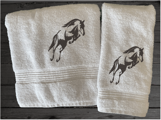 White bath towel and hand towel, embroidered jumping horse is the perfect design for the horse living family, that English decor. This Luxury horse towel set of 3 towels 1 bath towel 27' x 50", 1 hand towel16" x 27", 1 wash cloth 13" x 13". You can personalize the towel set with a name and an initial on the wash cloth or just the designs - Borgmanns Creations