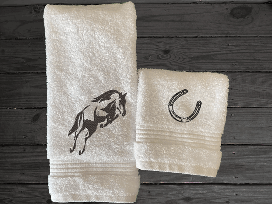 White hand towel and washcloth, embroidered jumping horse is the perfect design for the horse living family, that English decor. This Luxury horse towel set of 3 towels 1 bath towel 27' x 50", 1 hand towel16" x 27", 1 wash cloth 13" x 13". You can personalize the towel set with a name and an initial on the wash cloth or just the designs - Borgmanns Creations