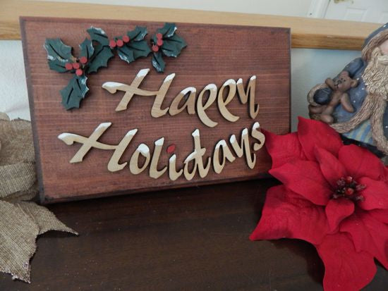 Wood wall hanging - laser cut lauan wood glued to 1" mahogany stained wood - layered wood for holly leaves - a touch of acrylic paint for snow on letters - 11 1/2" x 7 1/4" - Borgmanns Creations 