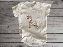 Load image into Gallery viewer, This Onesies ®, size 12 month, is white with short sleeves and an embroidered giraffe in brown just the gift you need to order for your baby shower gift. This bodysuit for new mom gift will be great for boy or girl as they grow so fast. Wonderful design for the animal nursery theme - Borgmanns Creations - 1
