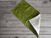 Load image into Gallery viewer, This photo is of the burp cloth for this bib and burp cloth set made of shades of green flannel top and terry cloth backing - bib 9&quot; from neck to bottom- 8&quot; wide with sticky fasteners, burp cloth is 16&quot; x 8&quot; will make a great gift for the new born baby shower, first birthday gift, etc.  To keep the baby dry from those frequent spills - Borgmanns Creations -2
