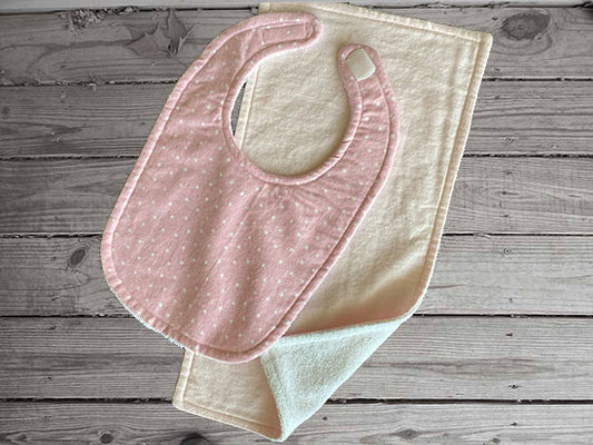 This bib and burp cloth set of white stars on pink background made of flannel top and terry cloth backing, bib 9" from neck to bottom- 8" with sticky fasteners, burp cloth is light pink 16" x 8"wide ,give as a great gift for the new born baby shower, to keep the baby dry from those frequent spills - Borgmanns Creations -1