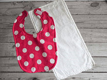 Load image into Gallery viewer, This bib and burp cloth set has a flannel top, pink with white polka dots and terry cloth backing bib 9&quot; from neck to bottom- 8&quot; wide sticky fasteners, white burp cloth is 16&quot; x 8&quot; with, will make a great gift for the new born baby shower.  To keep the baby dry from those frequent spills. Check it out today - Borgmanns Creations - 1
