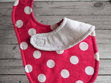 Load image into Gallery viewer, This bib and burp cloth set has a flannel top, pink with white polka dots and terry cloth backing bib 9&quot; from neck to bottom- 8&quot; wide sticky fasteners, white burp cloth is 16&quot; x 8&quot; with, will make a great gift for the new born baby shower.  To keep the baby dry from those frequent spills. Check it out today - Borgmanns Creations -
