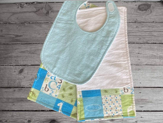 This bib and 2 burp cloth set - will make a cute gift for the new born baby shower. Made of flannel top and terry cloth backing bib 9" from neck to bottom- 8" with sticky fasteners,  burp cloth is 16" x 8" wide, to keep the baby dry from those frequent spills. Custom gift for a toddler - Borgmanns Creations - 1
