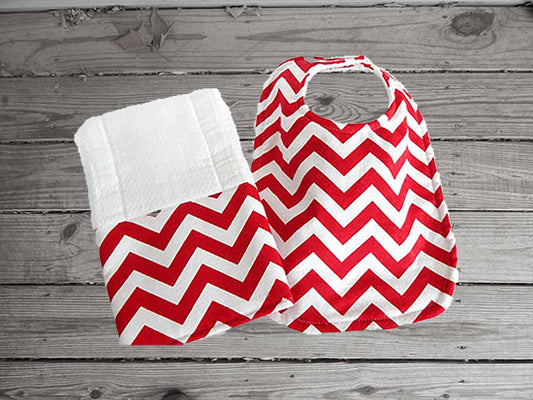 This bib and burp cloth set -red chevron design -made of flannel top and terry cloth backing, the bib 9" from neck to bottom- 8" wide with sticky fasteners, burp cloth- per fold diaper will make a cute gift for the new born baby shower to keep the baby dry from those frequent spills. Custom gift for a toddler - Borgmanns Creations - 1