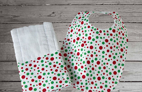 This bib and burp cloth set with green and red dots is made of flannel top and terry cloth backing the bib 9