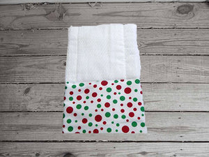 This photo of the burp cloth in this bib and burp cloth set with green and red dots is made of flannel top and terry cloth backing the bib 9" from neck to bottom- 8" wide with sticky fasteners, burp cloth is a pre fold diaper with matching material at the bottom of the burp cloth and will make a great gift for the new born baby shower, to keep the baby dry from those frequent spills - Borgmanns Creations -3
