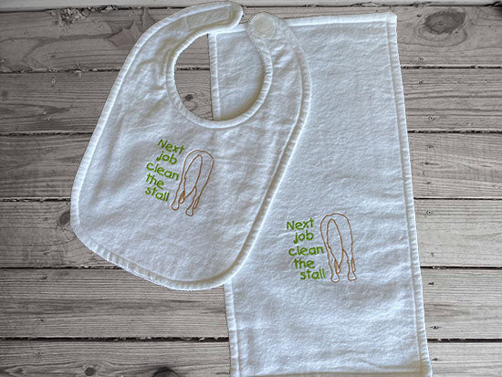 White bib and burp cloth set with the humorous saying - Next Job Clean the Stall - embroidered horse's back side with green littering, is made of flannel top and terry cloth backing. bib 9" from neck to bottom- 8" wide with sticky fasteners, the burp cloth is 16" x 8" makes a cute gift for the new born baby shower - Borgmanns Creations - 1