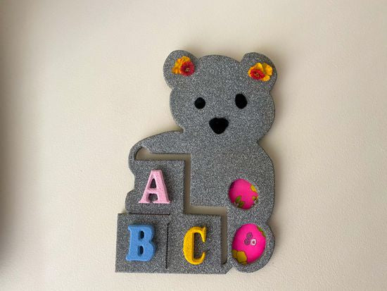 Wood wall art wall hanging,  1/2 MDF board, layered wood, hand painted,  with wire, pompom balls, flowers and a hanging hook on the back, 14" H x 10" W x 1/2" D, this cute wood sculpture of a teddy bear will make a great girl baby shower gift for a woodland nursery decor - Borgmanns Creations 