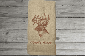 Beige Deer head hand towel, beautiful design to set off your bathroom or kitchen decor. Embroidered design on a terry towel, 16" x 27", soft and absorbent, personalized gift for the deer hunter you know, a great fall home decor towel or your deer hunter can use it when preparing the deer - 1