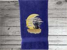 Load image into Gallery viewer, Blue hand towel, beautiful design of a cat watching the moon through the clouds, decorative towel for the bathroom or kitchen to brighten up your Halloween decor. You can personalize it for a gift to a friend or family member. The terry towel, 16&quot; x 27&quot;, is soft and absorbent for any bathroom - Borgmanns Creations - 2
