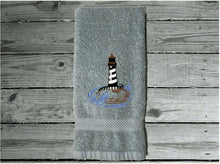 Load image into Gallery viewer, Gray Nautical hand towel - lake home decor - embroidered lighthouse on a cotton terry towel premium soft and absorbent, 16&quot; x 27&quot; - housewarming gift for travelers who live by the sea side or have weekend home by the water, a collector of lighthouses, Borgmanns Creations

