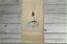 Load image into Gallery viewer, Beige Nautical hand towel - lake home decor - embroidered lighthouse on a cotton terry towel premium soft and absorbent, 16&quot; x 27&quot; - housewarming gift for travelers who live by the sea side or have weekend home by the water, a collector of lighthouses, Borgmanns Creations
