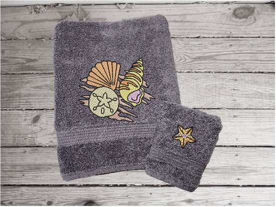 Gray bath towel 15" x 55" with washcloth 13" x 13" embroidered sea shells is can be purchased with a hand towel as a set. Personalized bathroom lake decor wonderful towel set for your home decor, housewarming gift or wedding gift. Borgmanns Creations 3