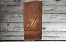 Load image into Gallery viewer, Brown Monogram towel personalized with an initial - soft hand towel that can be taken to collage for daughter or son - gift for mom for her bathroom decor or kitchen towel -  premium soft absorbent great colors for a gorgeous - embroidered in  Embassy font  - Borgmanns Creations - 3
