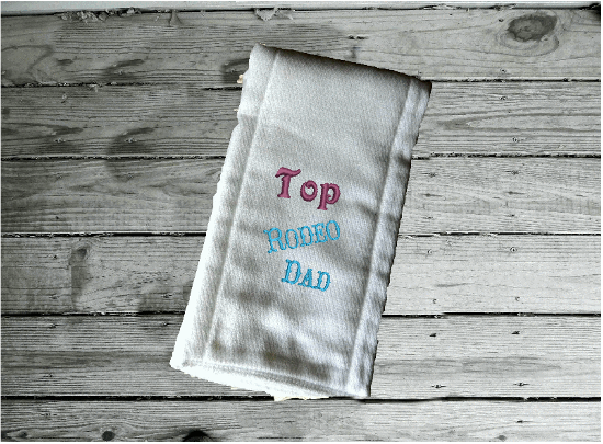 Bib burp cloth set embroidered Rodeo Dad design - baby shower gift farmhouse decor - wonderful gift set for a new born or toddler - Bib has flannel top with terry backing is 13" in over all length, 7 1/4" from neck to bottom and 8 3/4" at widest point - sticky fasteners - burp cloth is tri fold diaper - Borgmanns Creations 3