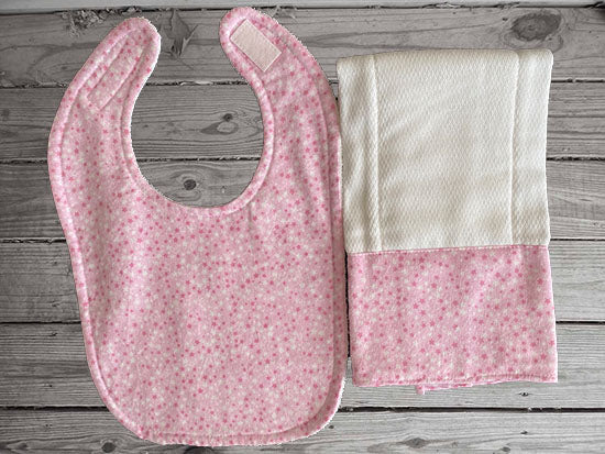 This bib and burp cloth set -pink with stars design - will make a cute gift for the new born baby shower. Made of flannel top and terry cloth backing,  bib 9" from neck to bottom- 8" wide with sticky fasteners, burp cloth is 16" x 8" to keep the baby dry from those frequent spills. Custom gift for a toddler - Borgmanns Creations - 1