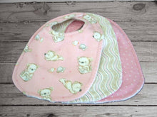 Load image into Gallery viewer, Get this set of 3 bibs for your little princess as a baby shower gift, a gift for the new mom, birthday gift for her first birthday. Made of flannel top and terry cloth backing, sticky fasteners, bib 9&quot; from neck to bottom- 8&quot; wide, to keep the baby dry from those frequent spills. Custom gift for a toddler - Borgmanns Creations - 1
