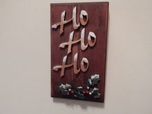 Load image into Gallery viewer, HO HO HO wall hanging - holiday decoration - gift for mom - layered laser cut luan wood and glued to 1&quot; beveled edged mahogany stained wood - hanging hook on back - wood wall art - gift for her home decor. - 9 1/2&quot; x 5 1//2&quot; - Borgmanns Creations
