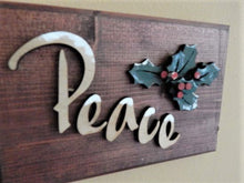 Load image into Gallery viewer, Peace wall hanging - Christmas decor gift for mom - wood wall plaque - laser cut lauan wood glued to a 1&quot; beveled edge wood with mahogany stain - hanging hook on back - 8 1/2&quot;H x 5 1/2&quot; W x 1 1/2&quot;D - housewarming gift teacher gift coworker gift - Borgmanns Creations
