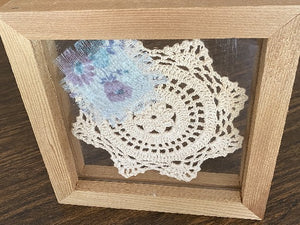 Crochet doily -  one of a kind wall hanging, or it can stand alone on any side -  wonderful gift country farmhouse decor - bedroom decor ideas for your home or a special gift - doily is vintage star pattern between 2 pieces of acrylic and framed in wood-  a piece of material to complement the doily - 7 1/8" H x 7 1/8" W x 1 1/4" D- Borgmanns Creations - 7